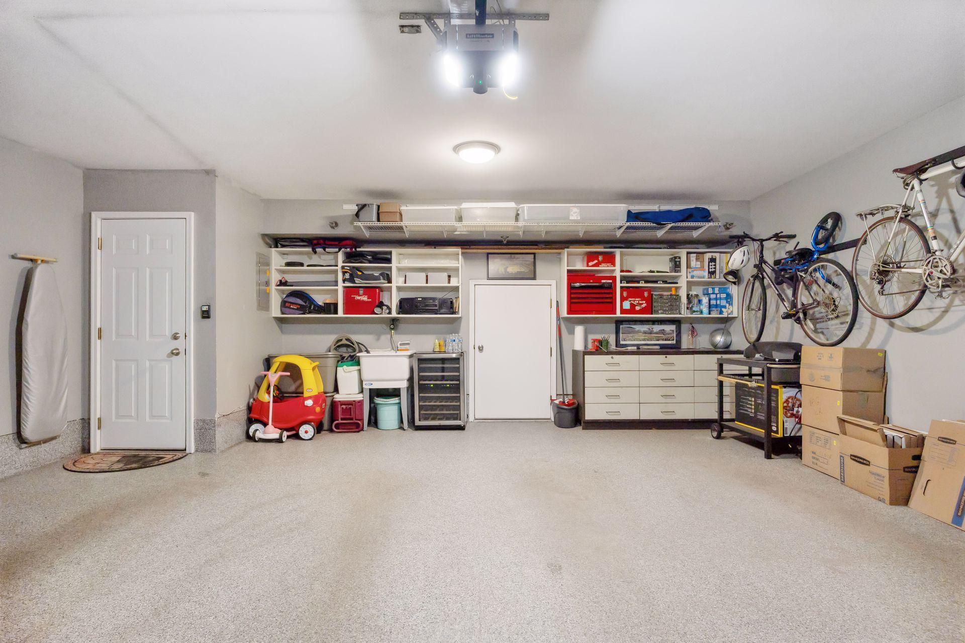 2 car garage with door to storage area
