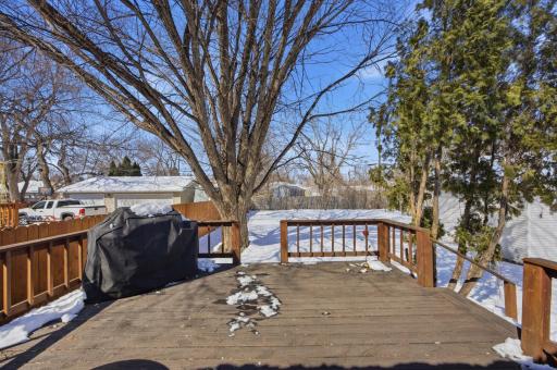 Large deck overlooking fully fenced back yard