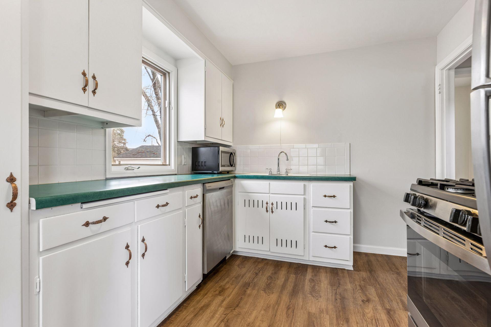 Freshly painted kitchen with updated appliances.