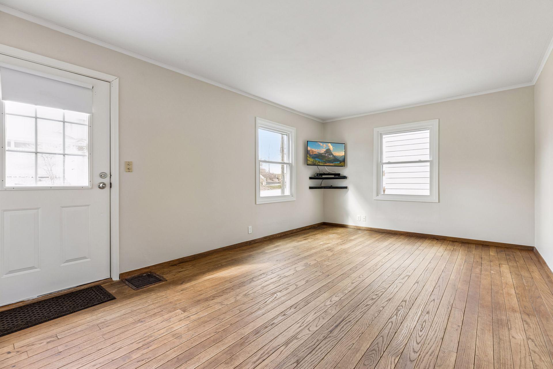 Bright living room with original hardwood floors.