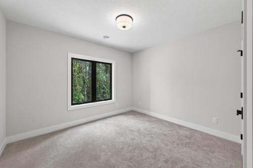 Bright and comfortable, this inviting bedroom offers the perfect space for family, guests, or a quiet retreat.