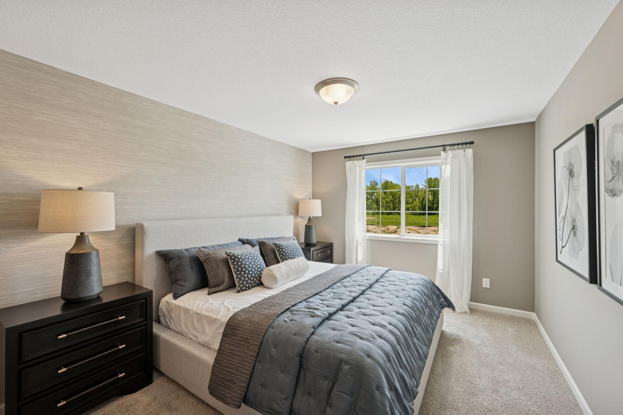 Primary Bedroom - photo is of model home for illustrative purposes