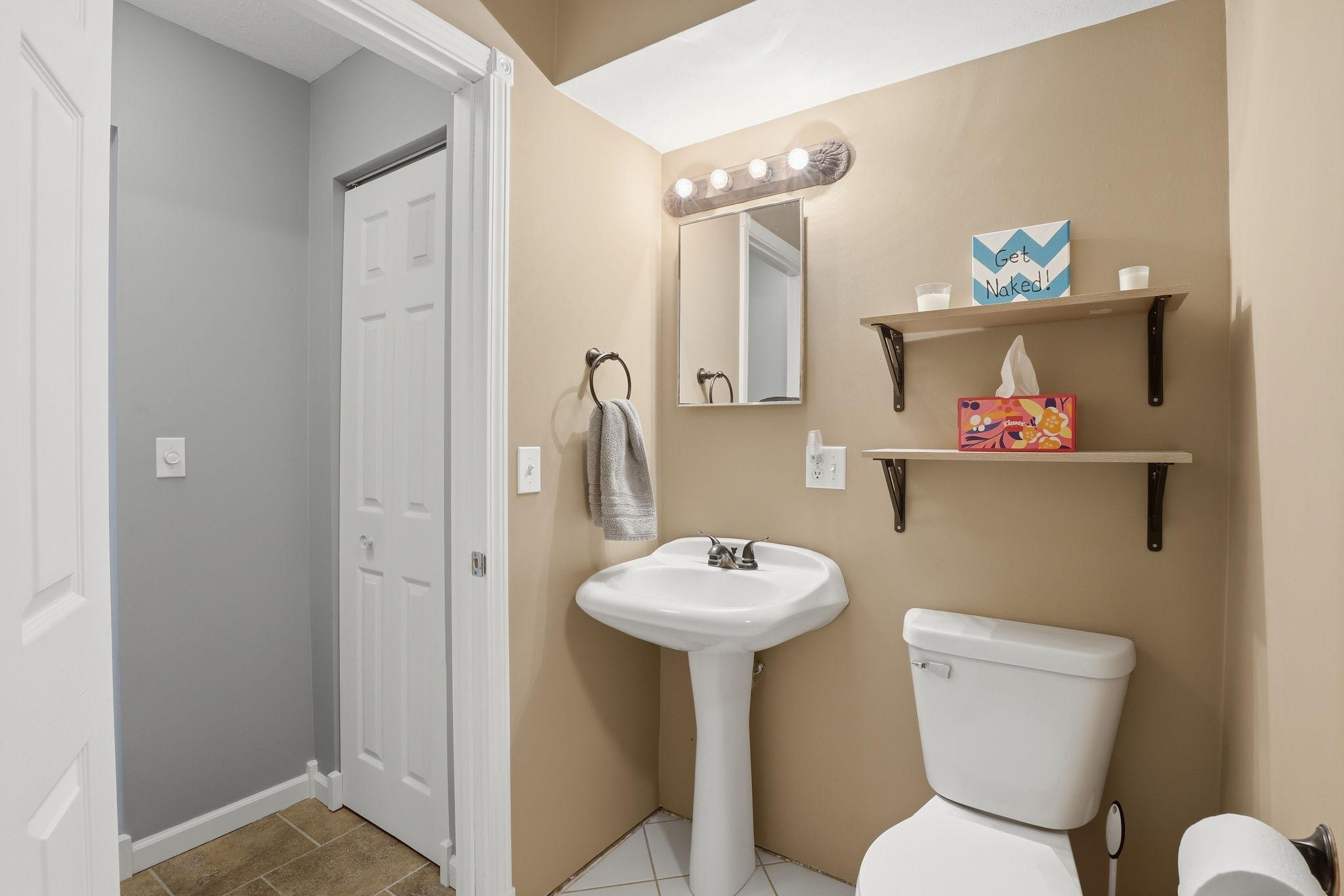 Convenient 3/4 bath in lower level with nice storage outside.