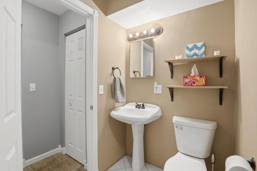 Convenient 3/4 bath in lower level with nice storage outside.