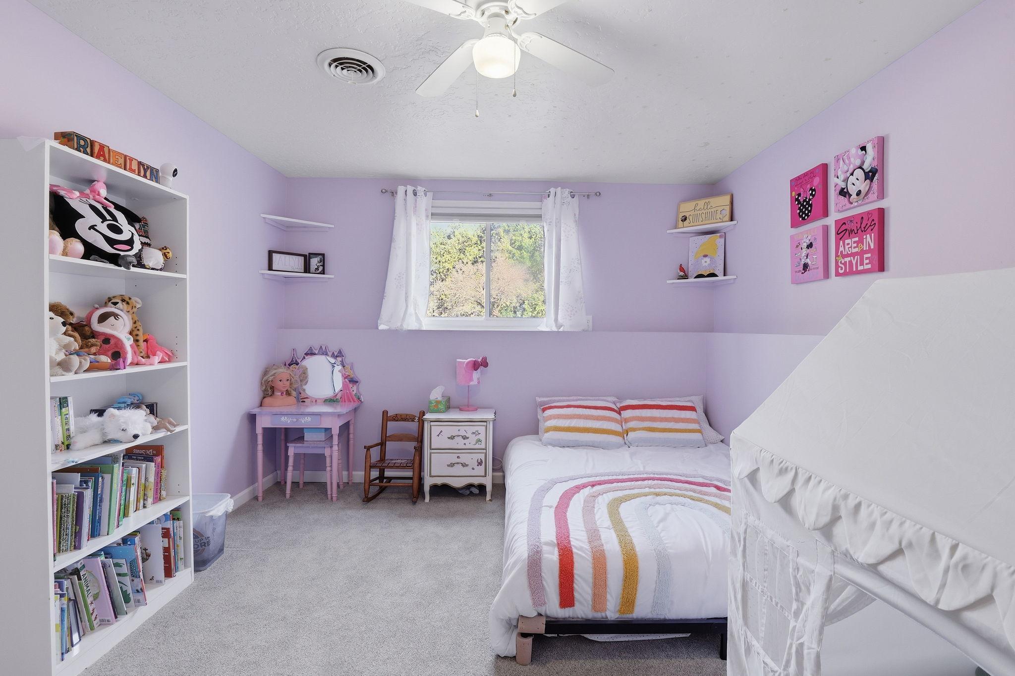Lower level bedroom with newer paint and carpet.