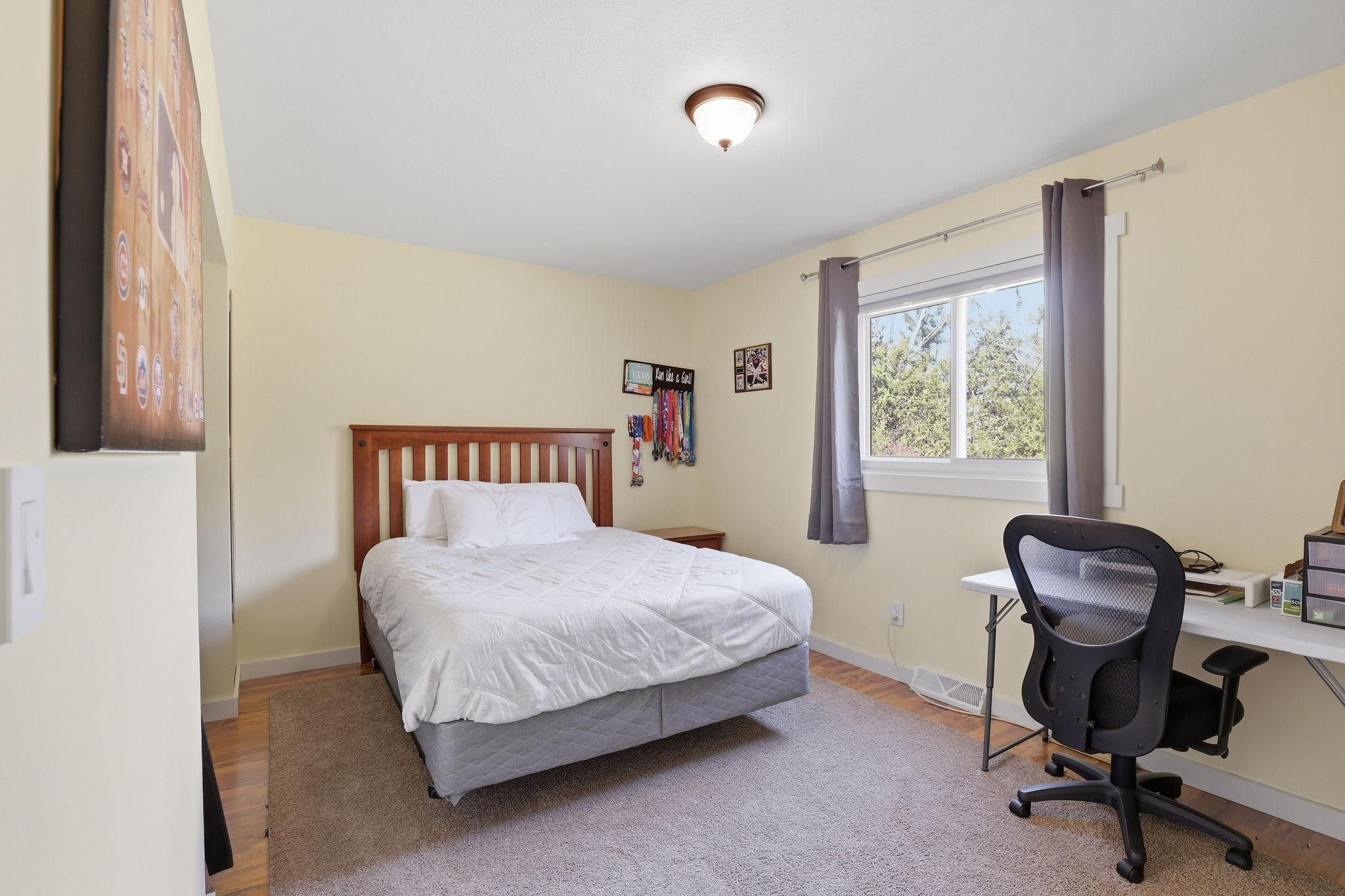 Spacious main level bedroom, home office or both!