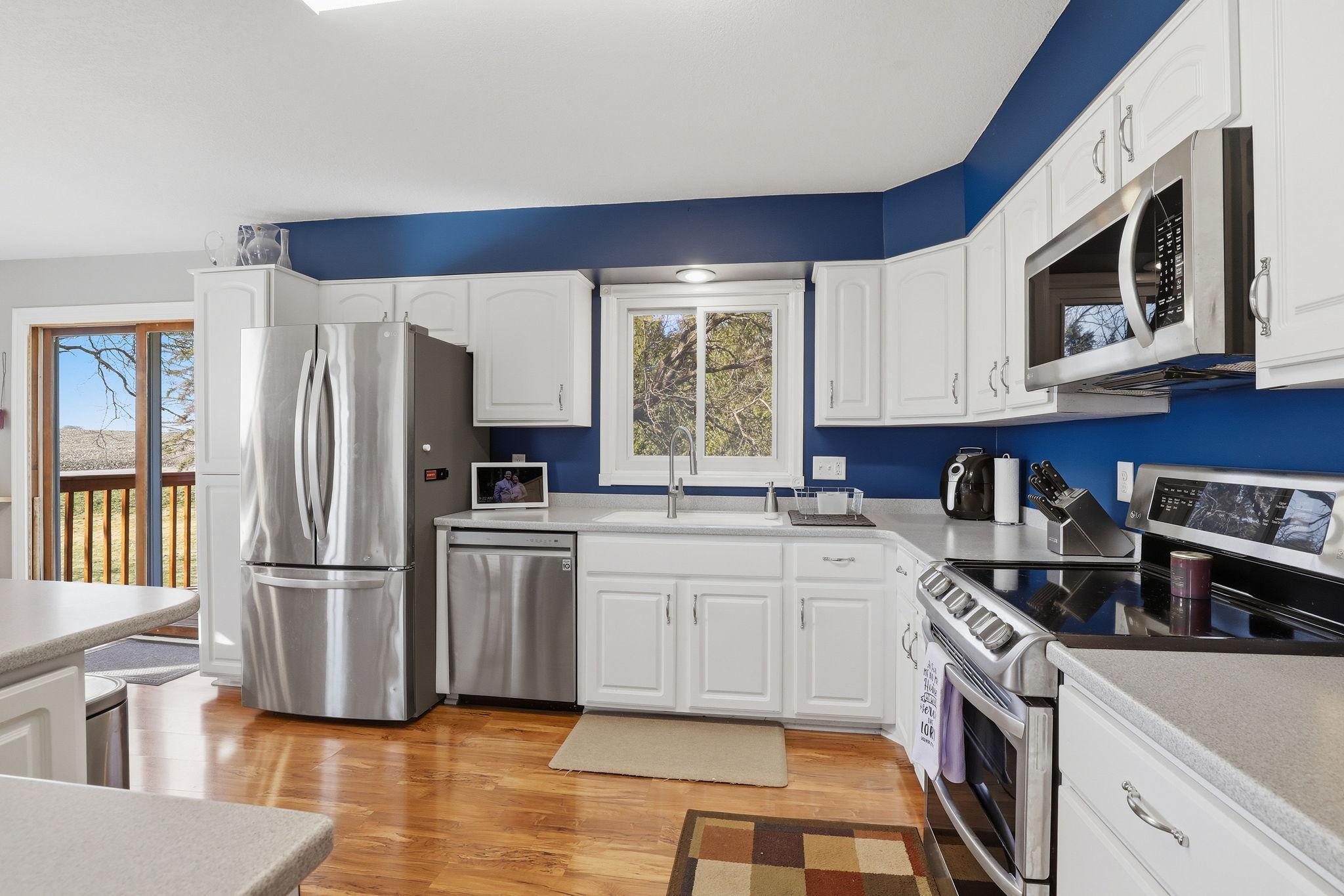 Nicely updated kitchen has newer appliance and solid surface countertop.