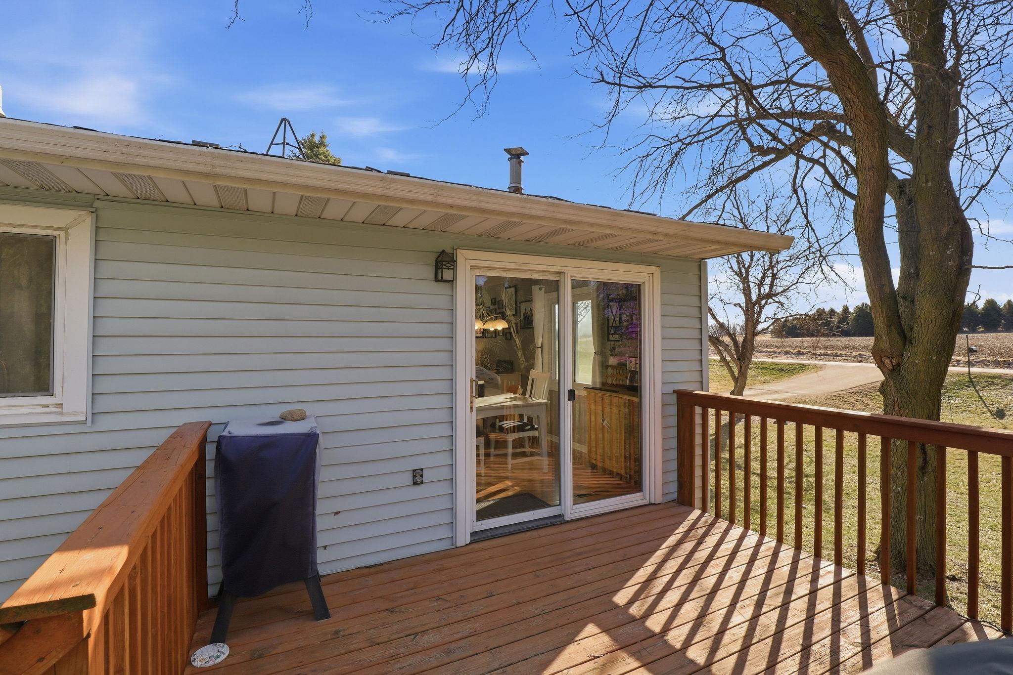Very nice deck which leads down to a newer aggregate patio.
