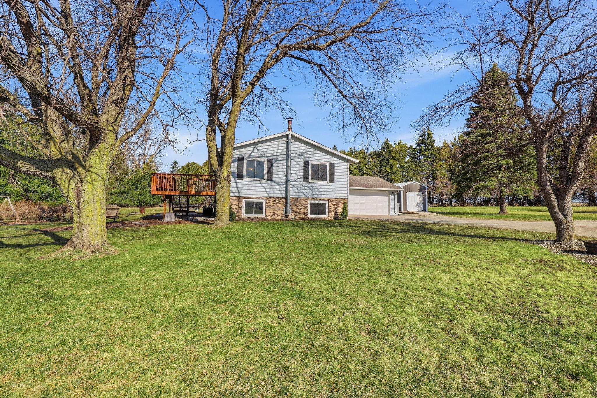 Beautiful mature trees throughout the spacious yard.