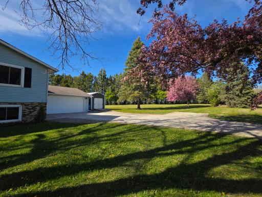 Convenient attached double garage and new additional storage shed with electricity.
