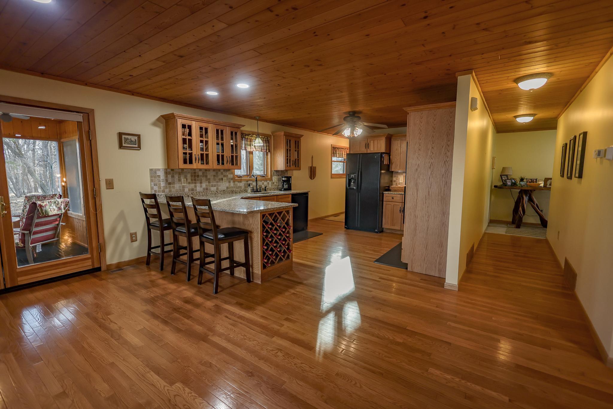 Natural Hardwood floors and a tongue and groove ceiling creates an up north warmth like no other!