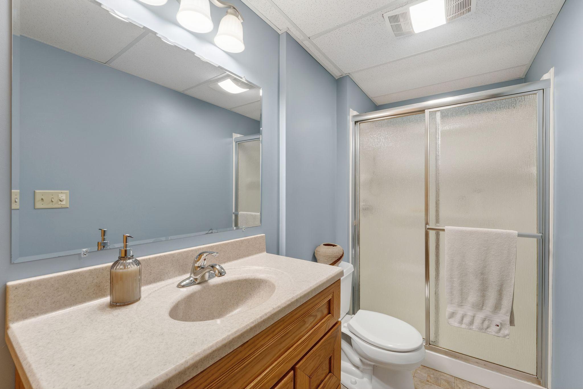 A thoughtfully designed guest-friendly bath with room for everything