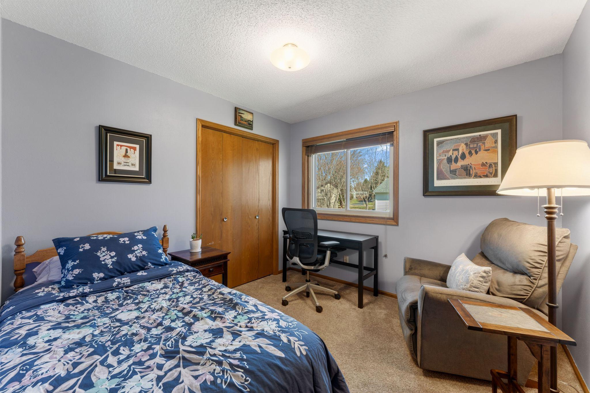 Bedroom #2 where florals soften the space and ideas find room to grow.