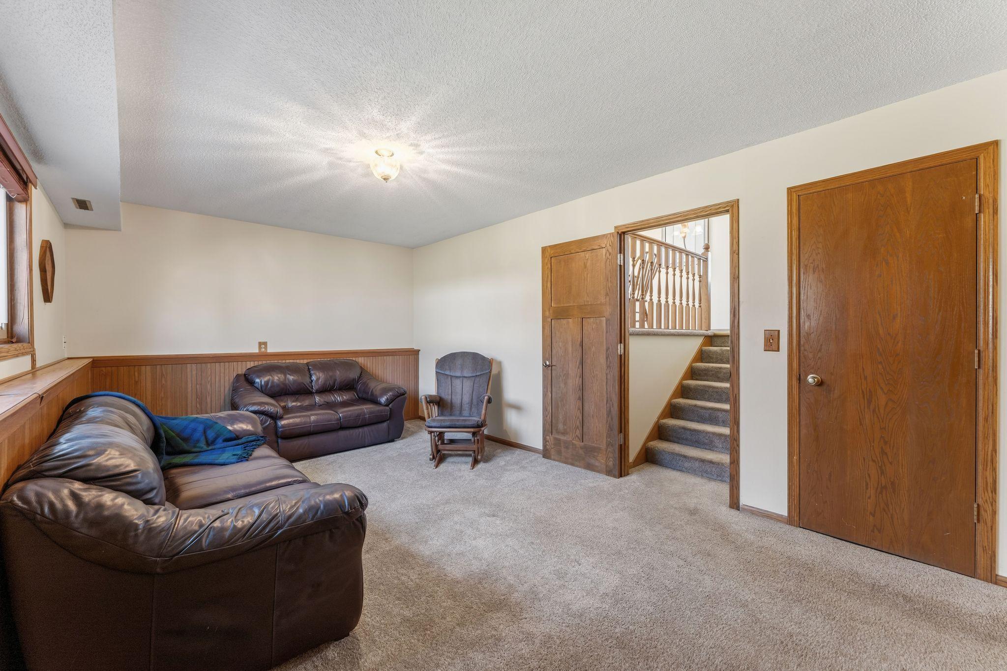 The family room is a cozy retreat where evenings naturally gather.