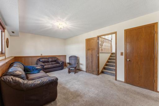 The family room is a cozy retreat where evenings naturally gather.