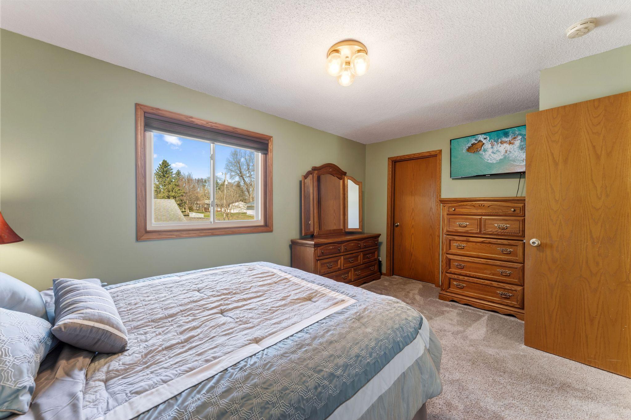 The owner’s retreat balances calm and care, with a walk-in closet that keeps life tidy