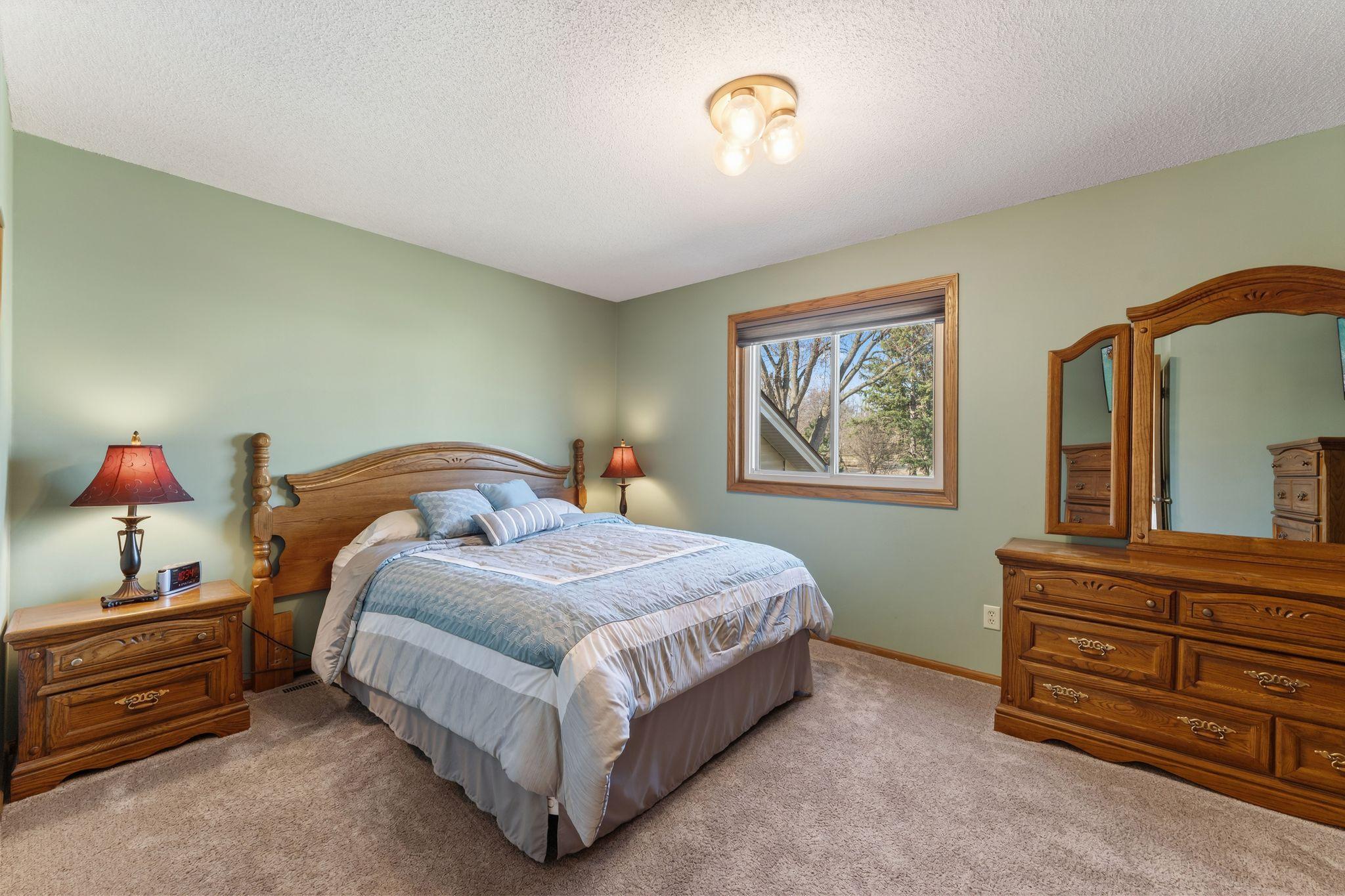 Another view of the primary bedroom