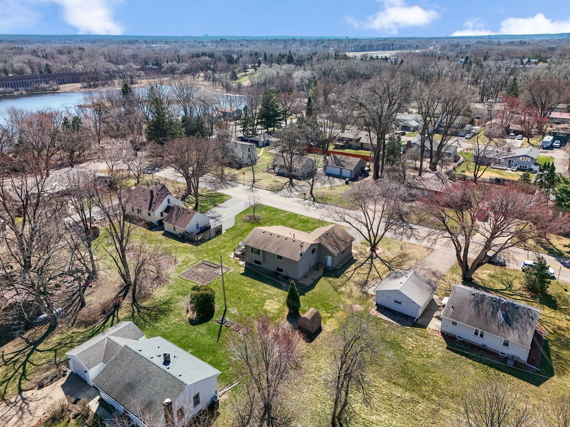 The aerial view of the back of the Garden House shows how close Savage Lake is