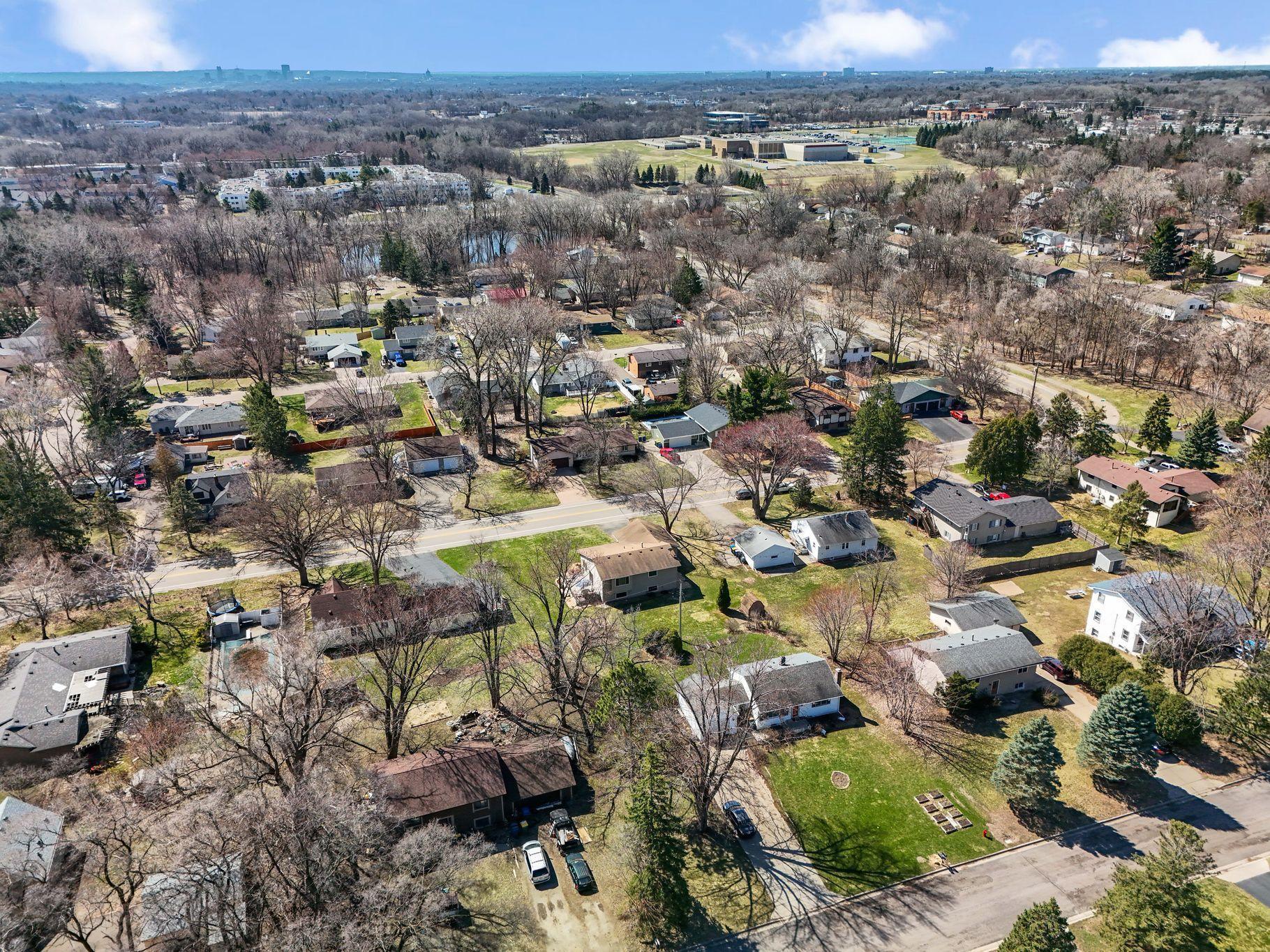 The aerial views show the middle school as well at the St. Paul and Minneapolis skylines in the distance