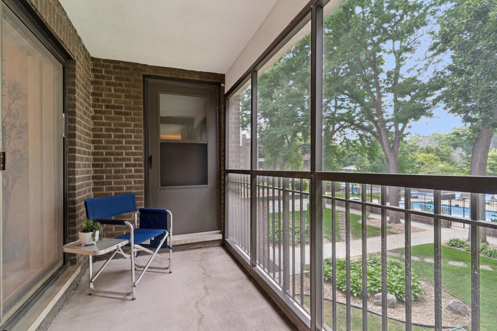 The porch overlooks the lovely pool area