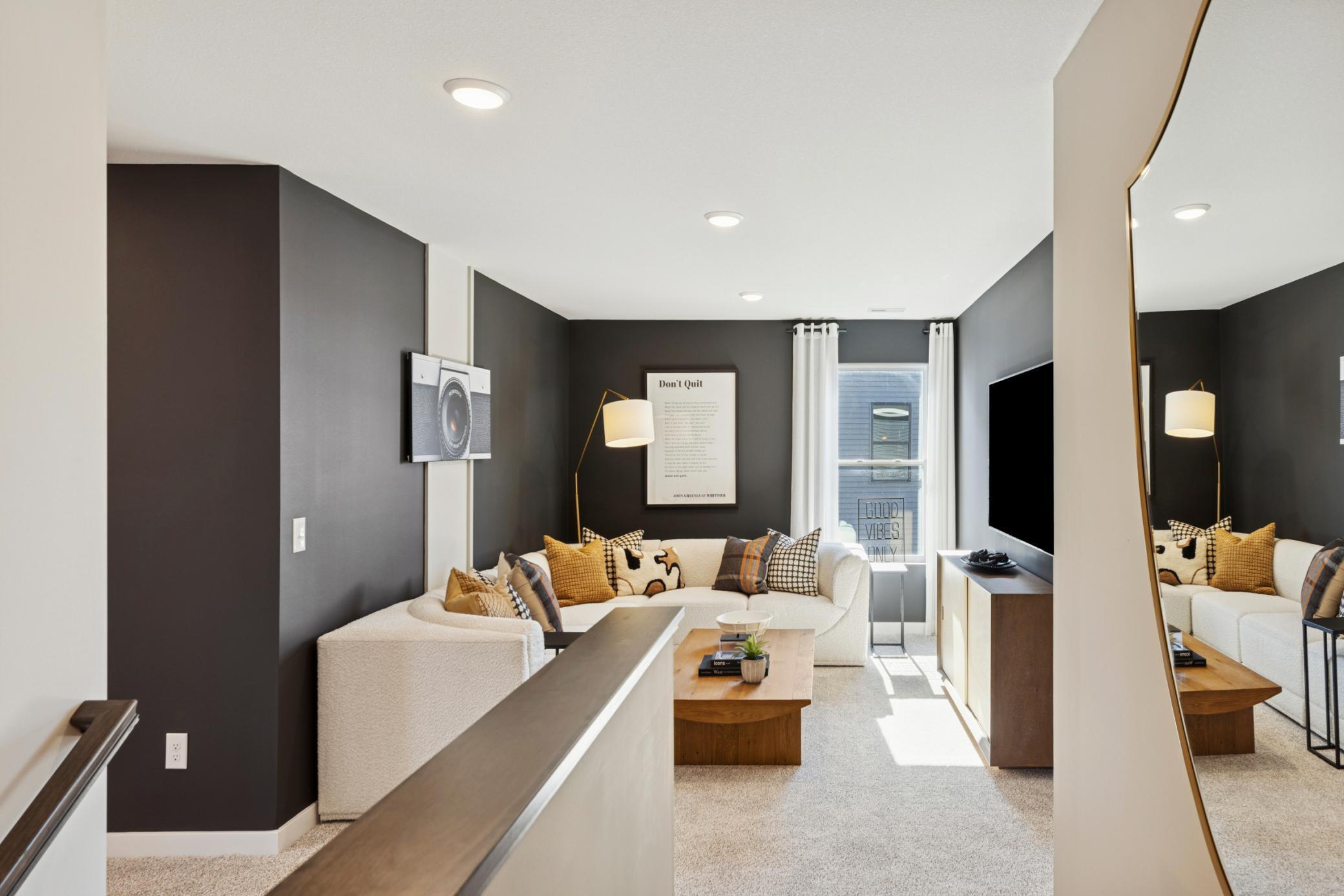 The thoughtfully designed loft provides a secondary living space in the home perfect for any need..jpg