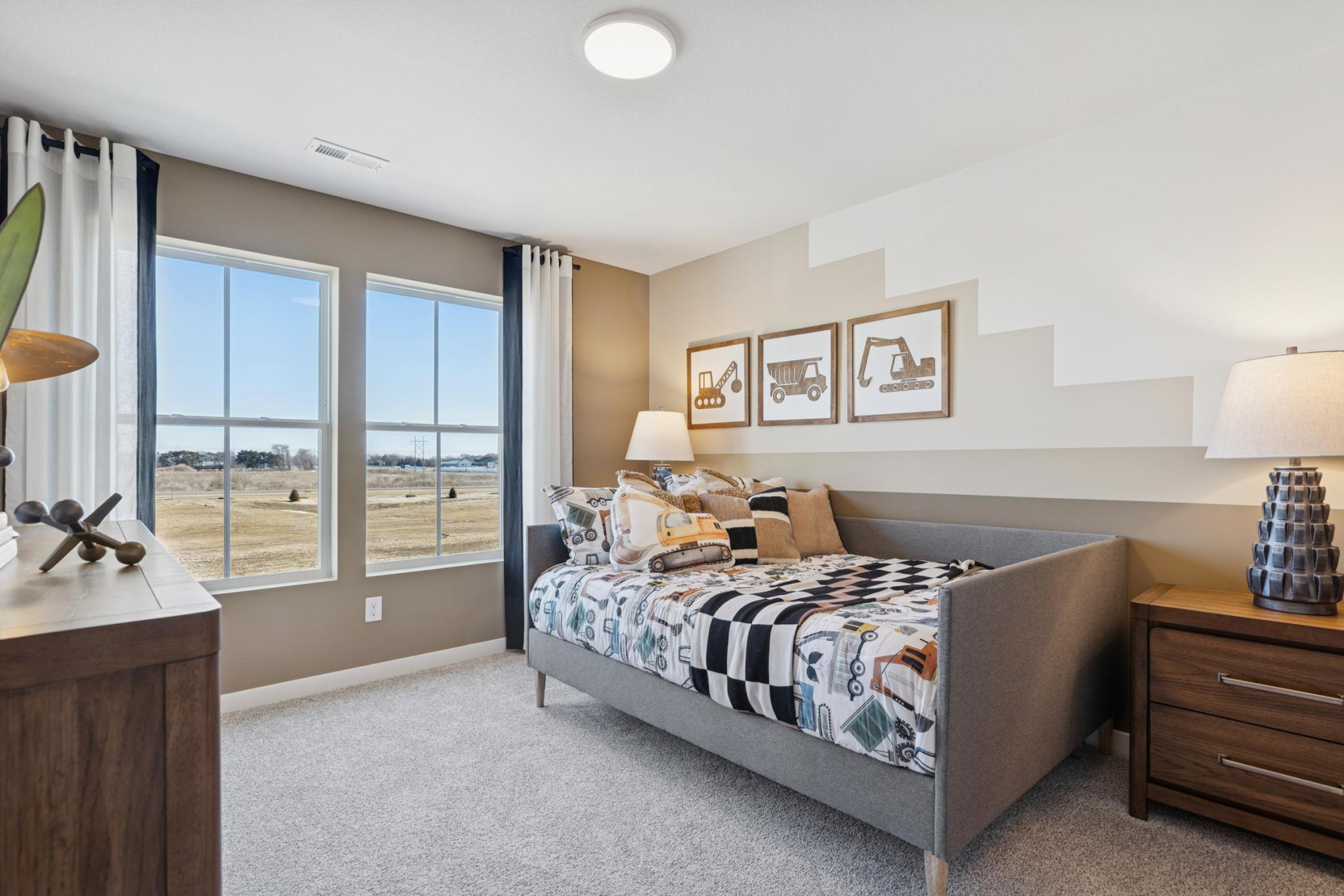 Flexible in its use, this guest bedroom can easily serve as a cozy retreat, home office, or additional sleeping space as needed..jpg