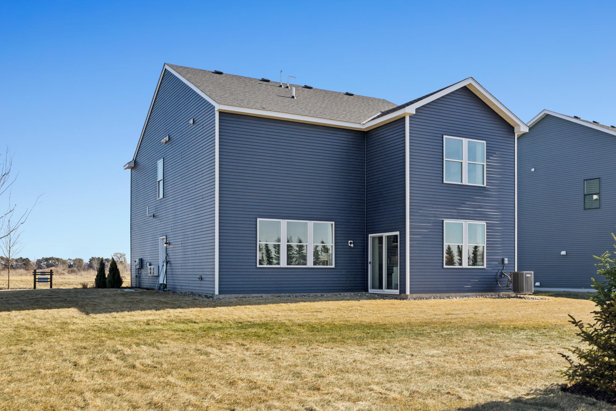 High-quality modern materials, including vinyl siding, stone accents, and contrasting trims combine to create a sophisticated and durable exterior..jpg