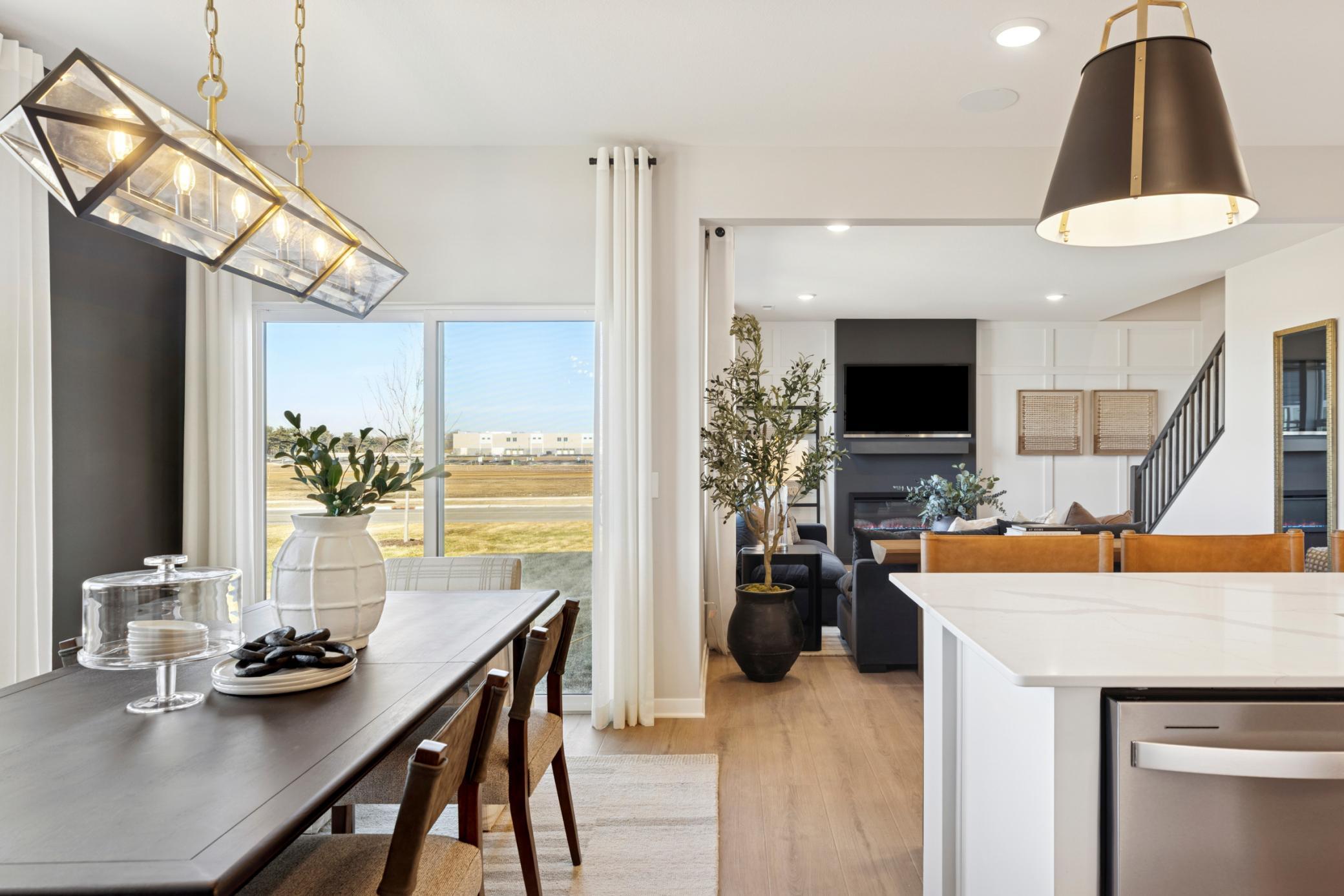 The dining area’s location within the open floorplan provides easy access to the kitchen, living area, and outdoor spaces, perfect for indoor-outdoor living..jpg