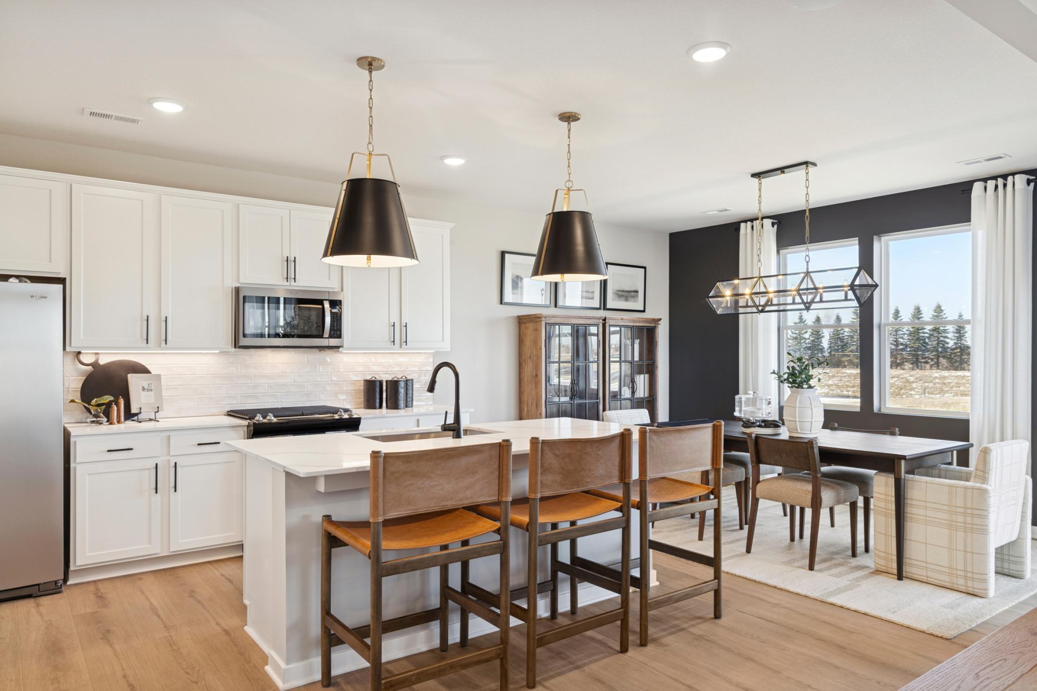 Central island offers additional prep space, seating, and storage, making it the heart of the home..jpg