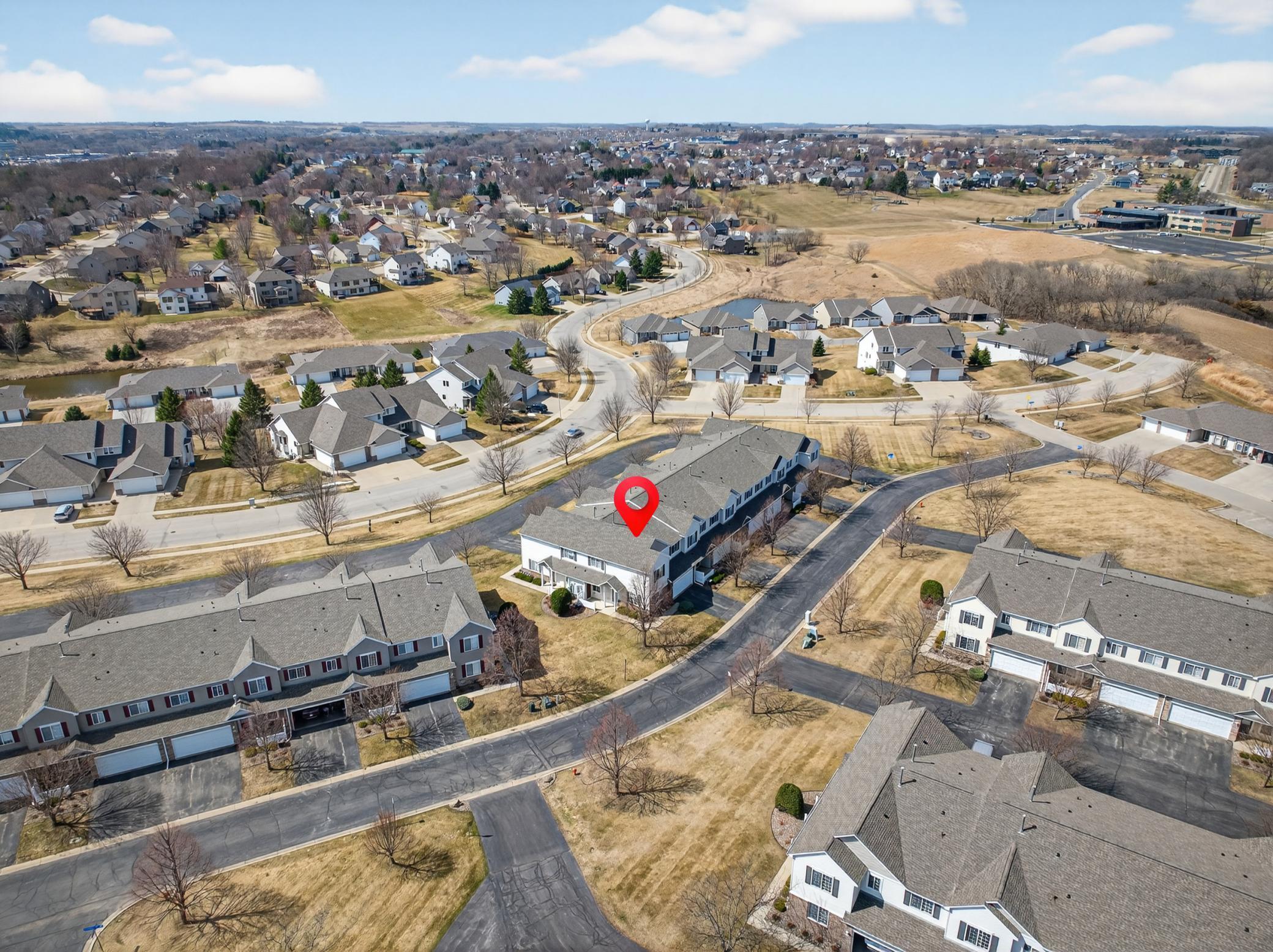 Crimson Ridge Townhomes with Overland Elementary in Background.
