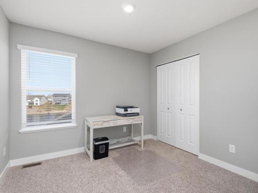 2nd of the 4 upper level bedrooms, looks to backyard.