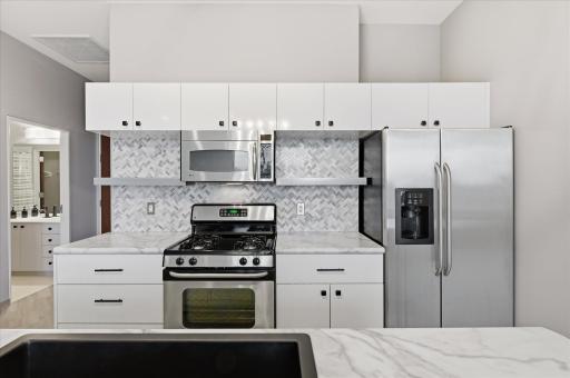 Practical, utilitarian kitchen with thoughtful design that optimizes storage, workflow, and usability.