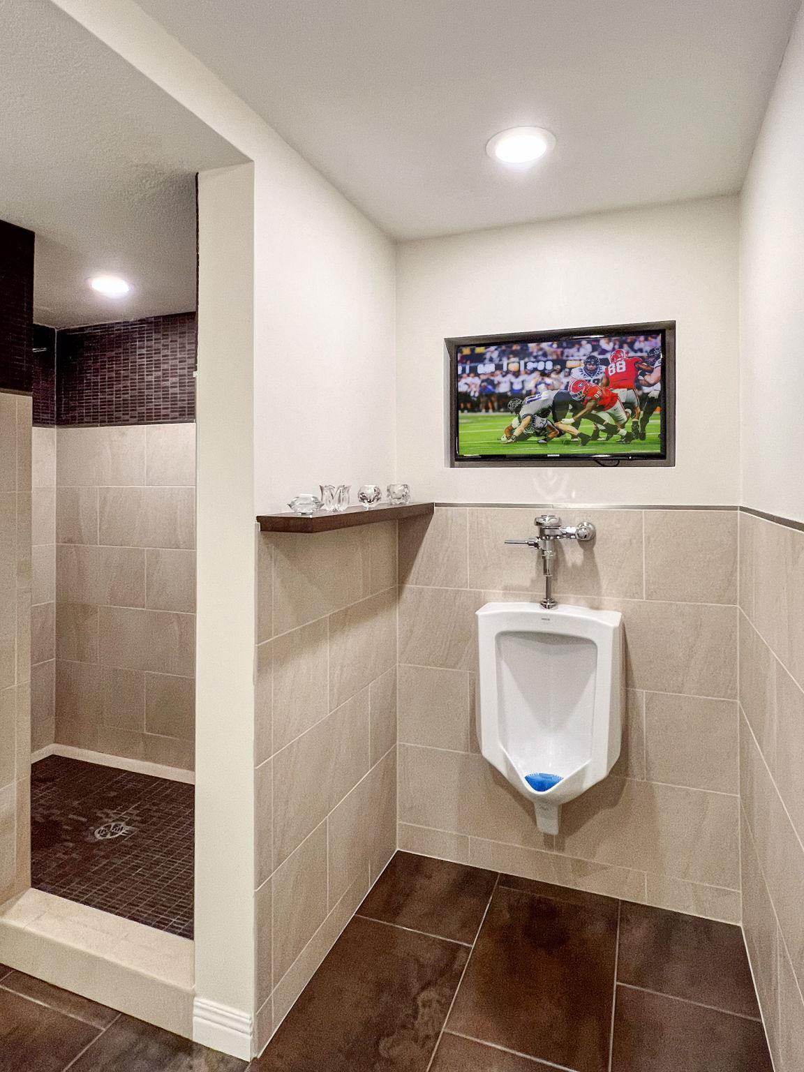 lower level, 3/4 bath is complete with urinal and TV