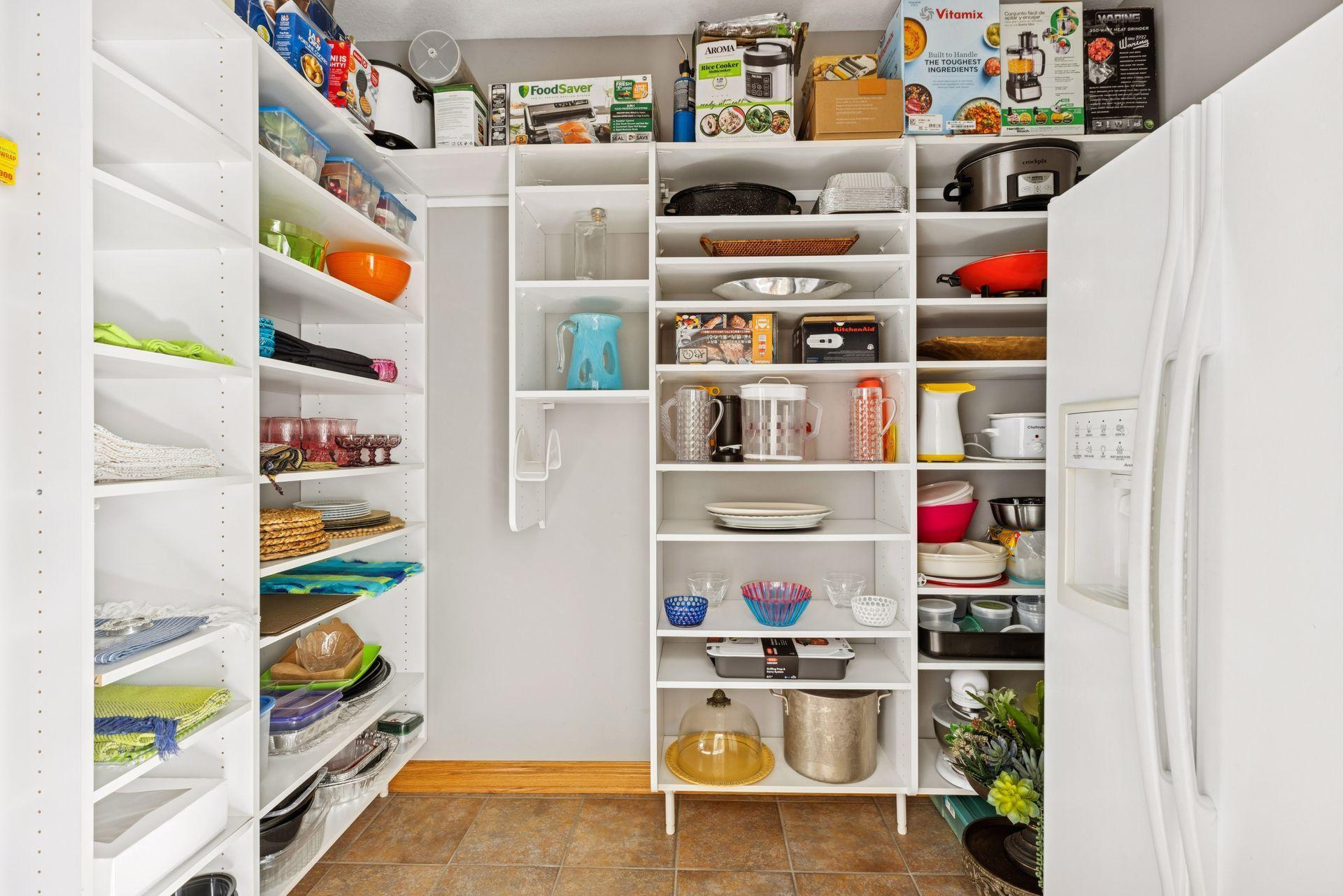 An additional pantry off the back mudroom features amazing storage