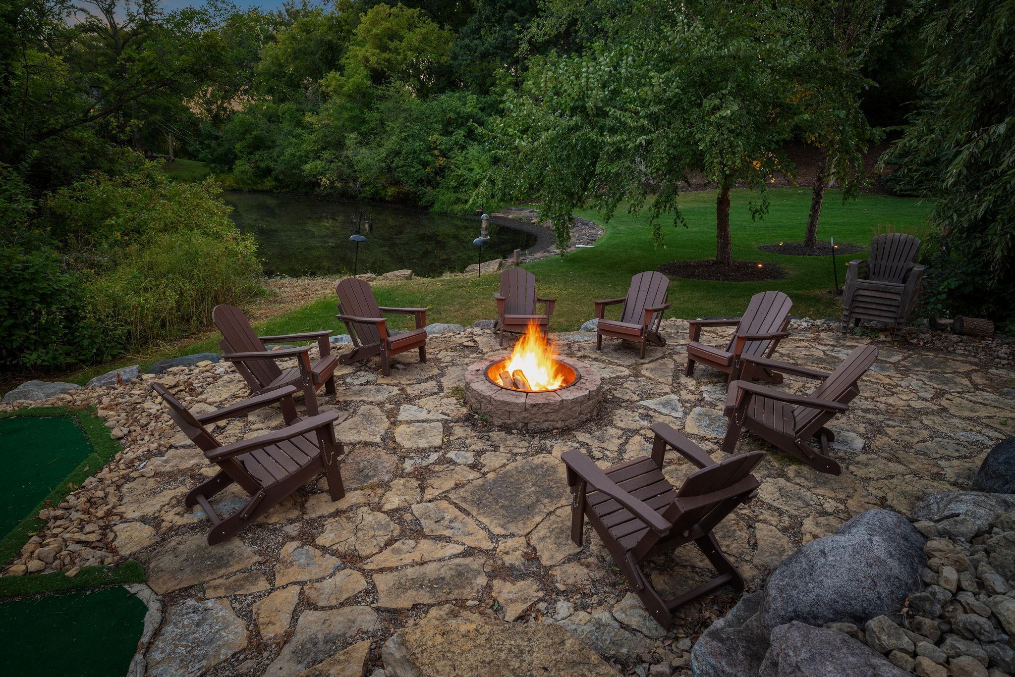 enjoy cozy firepit in private backyard