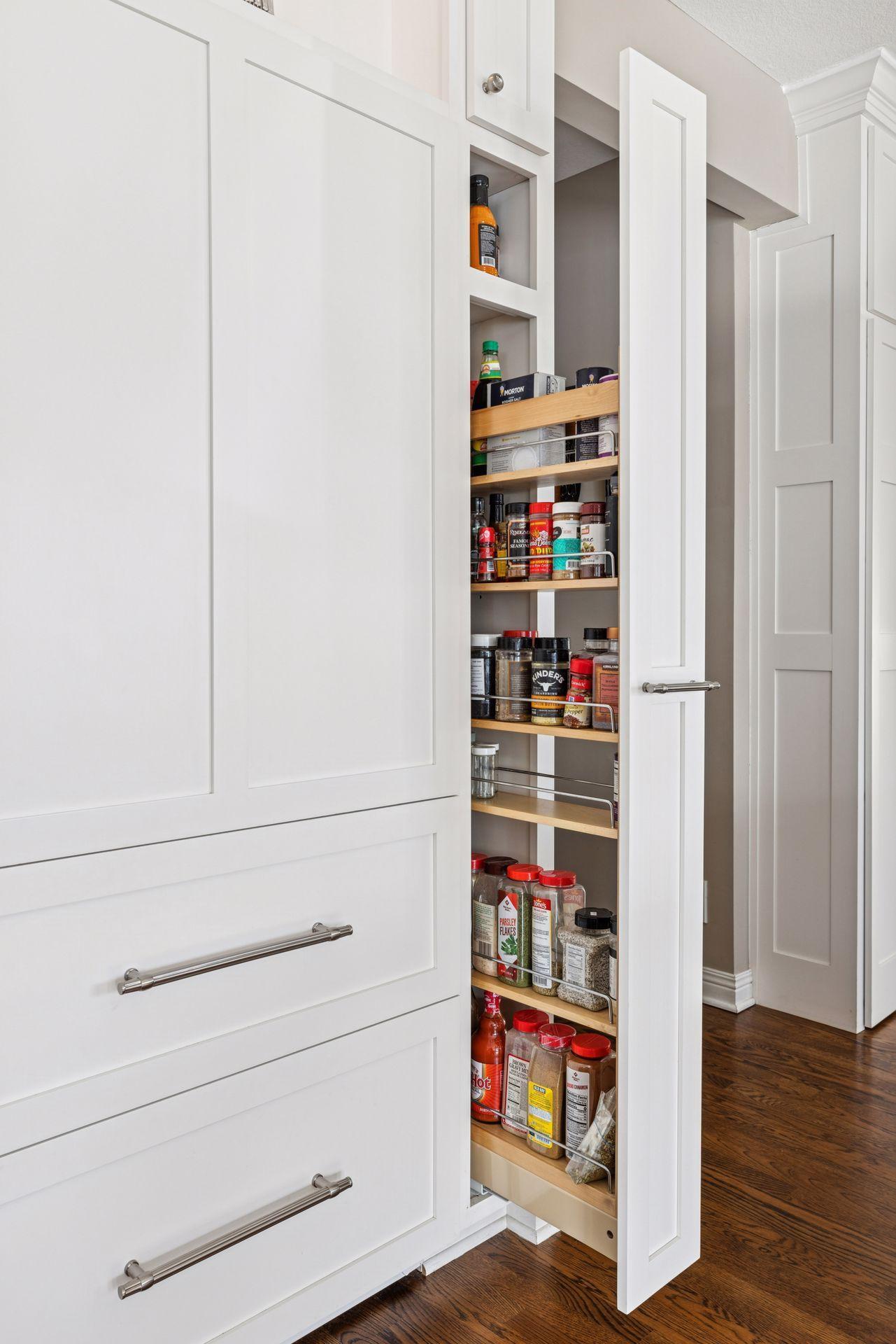 hidden spice racks on both sides of the massive refrigerator/freezer