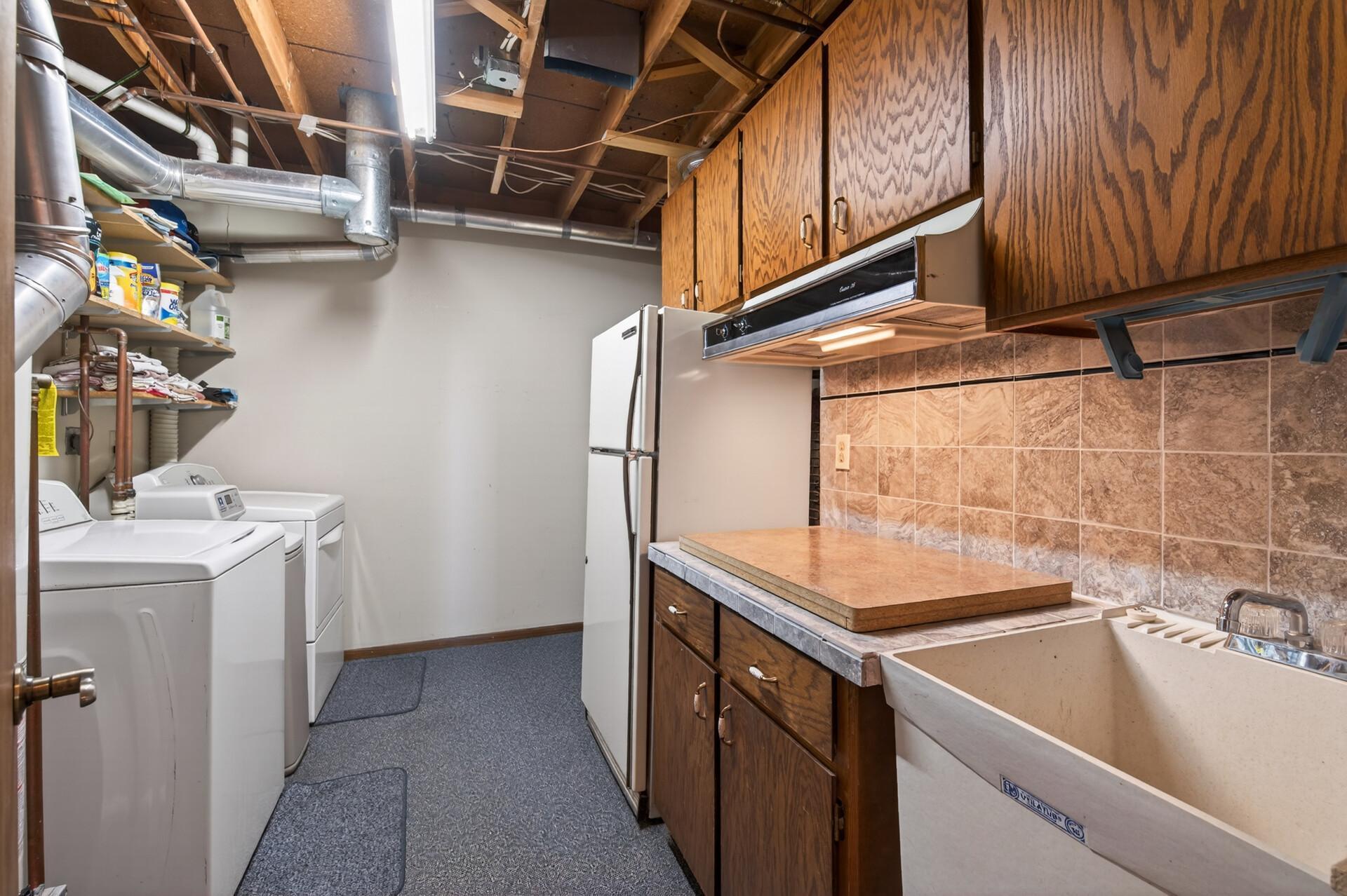 Mechanicals, laundry and storage! There is also a second cooktop and refrigerator