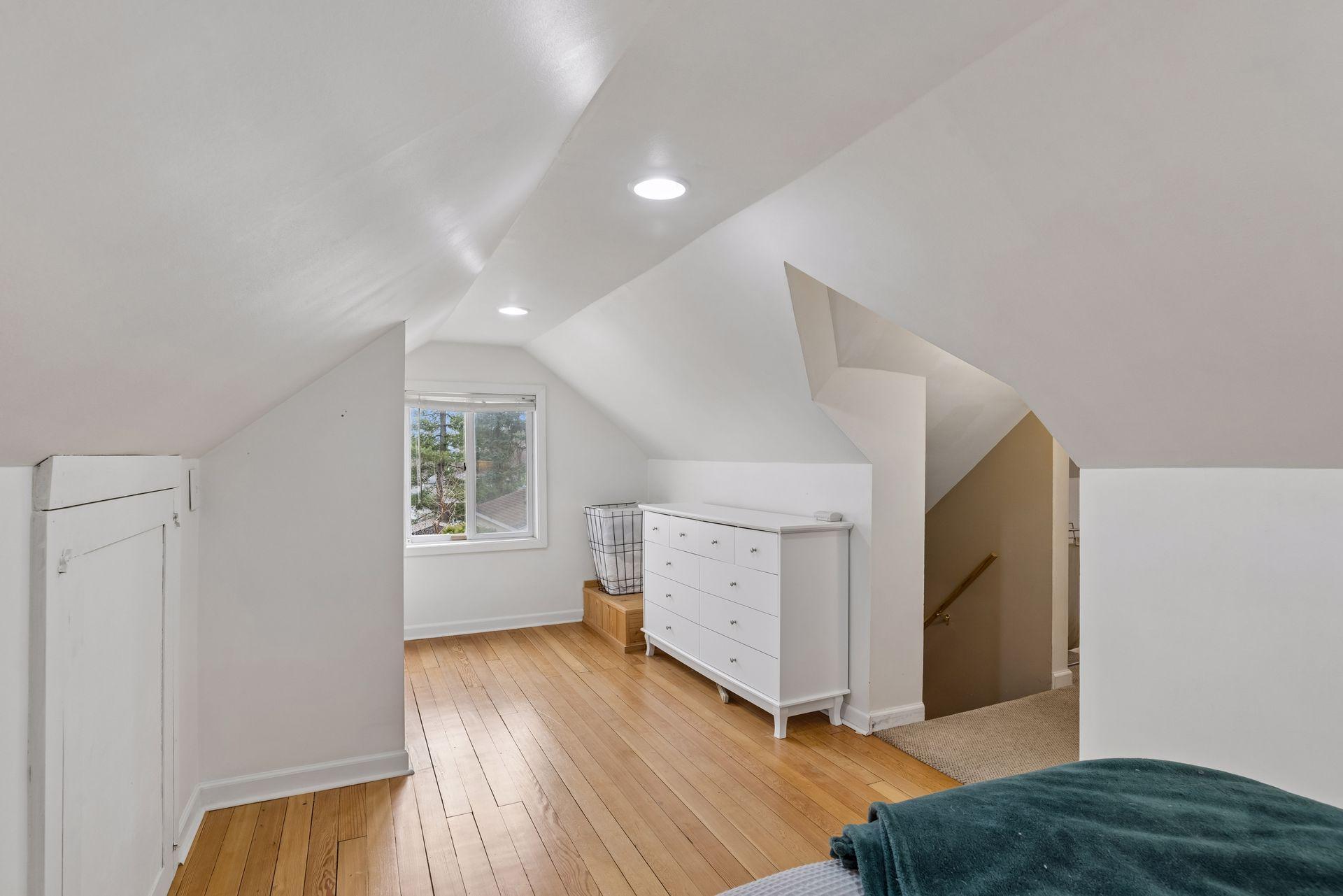 Upper level features beautiful hardwood flooring