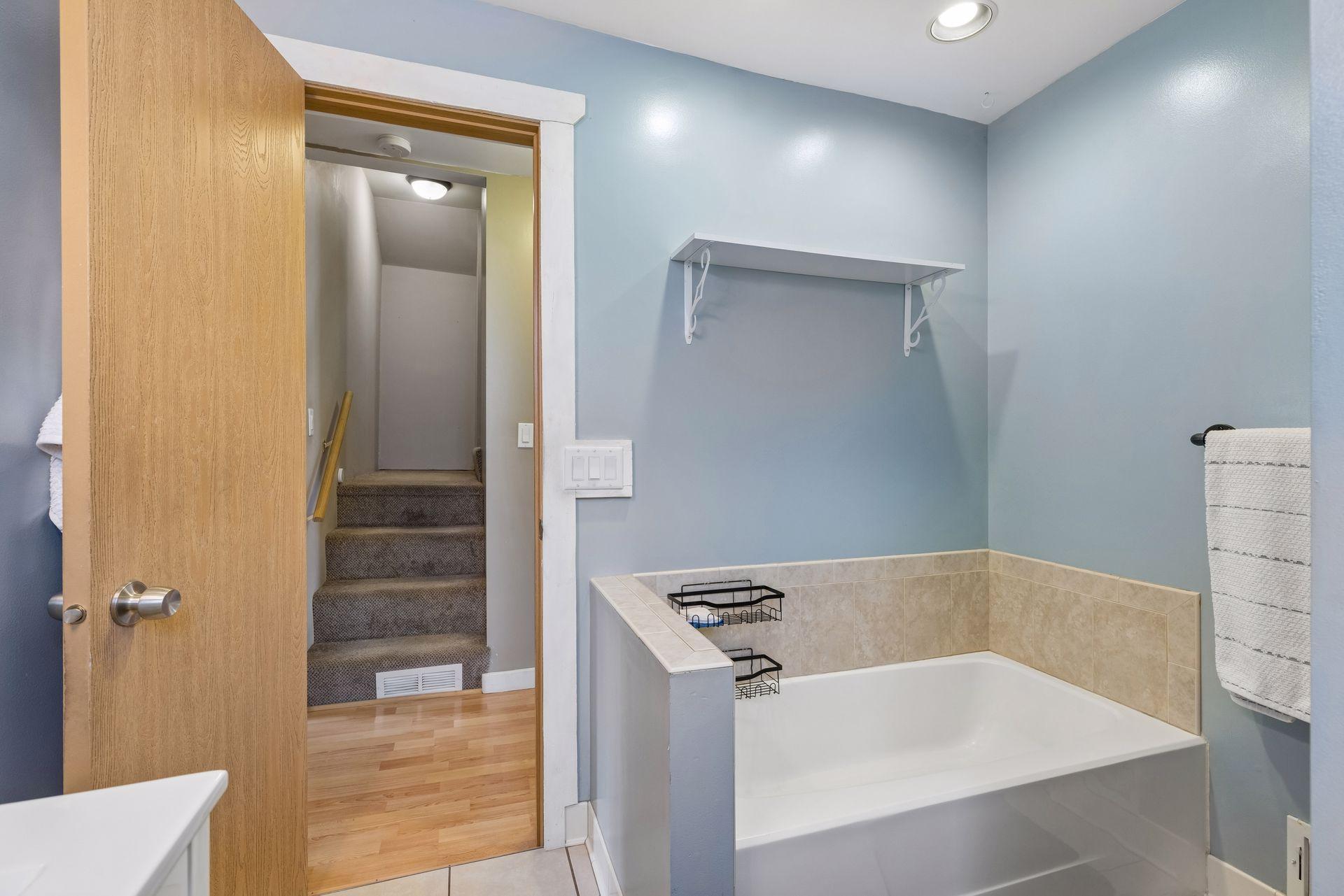 Separate tub and shower in the main level bath