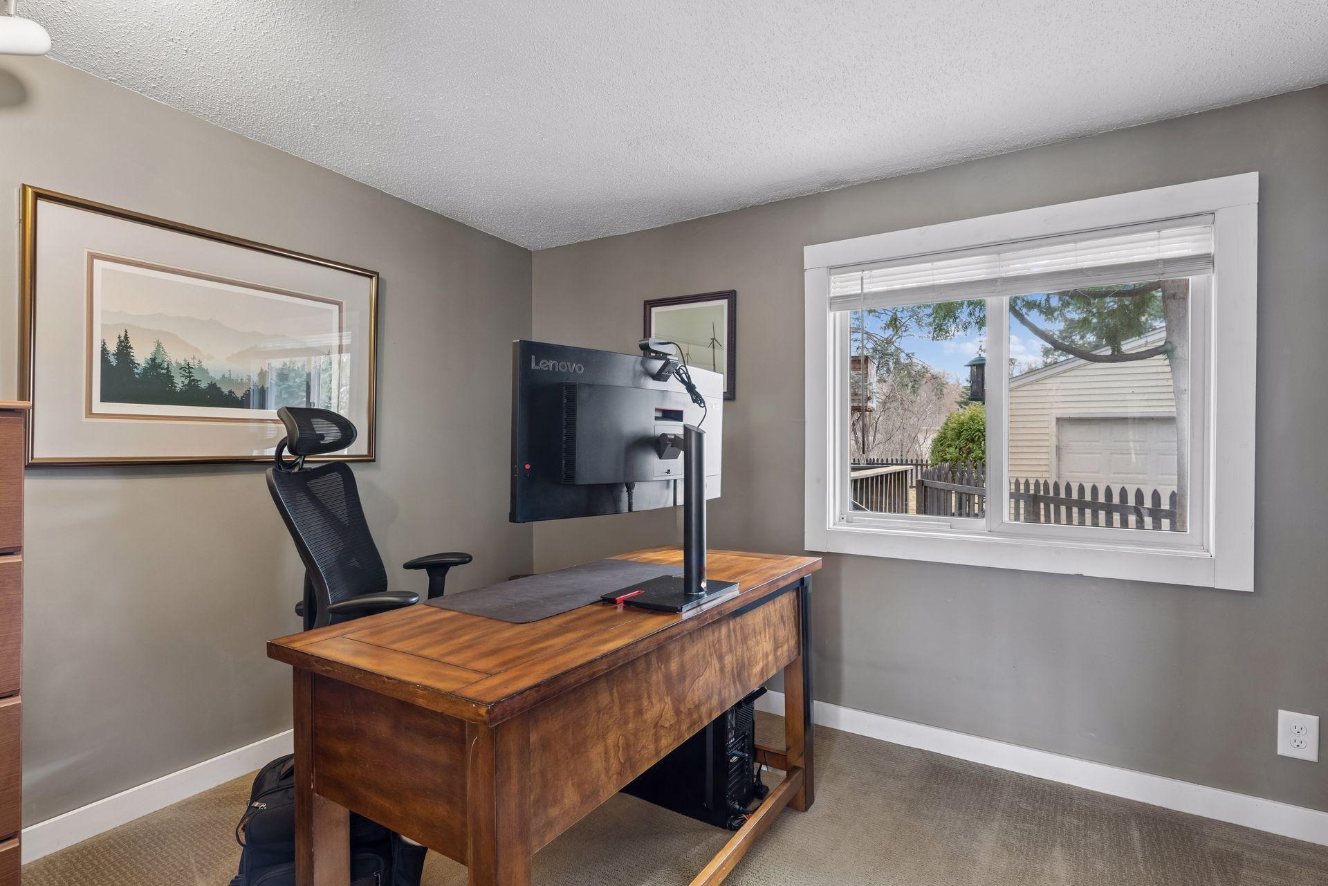 Main level bedroom currently used as office