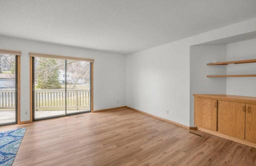 Living Room w/Built-in Cabinet, Sliding Doors to Deck