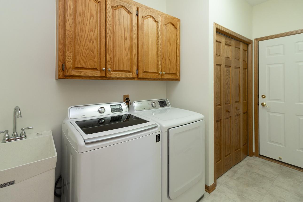 Convenient mud room and first floor laundry as you enter from the three car garage