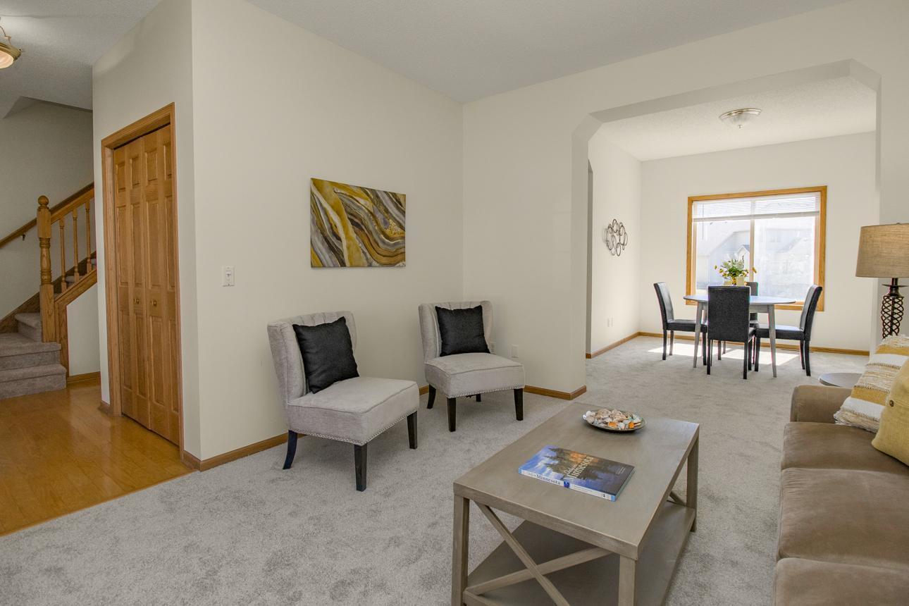 Living room off front foyer and ajoining dining room can accomodate larger gatherings