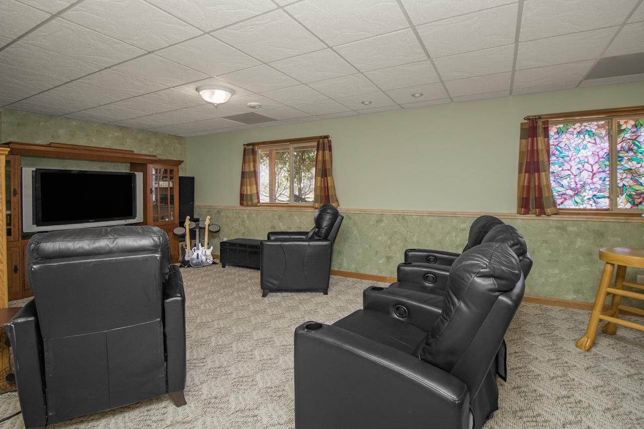 Home theater is equipped for movie night or the big game