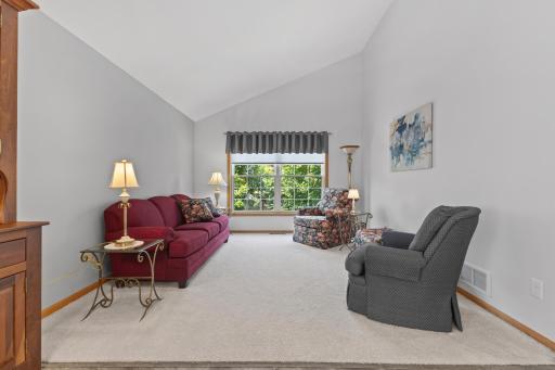 Neutral carpet and walls allow for a move in ready home. Enjoy the oversized window overlooking the natural backyard setting.