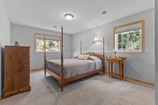 The lower level bedroom is filled with natural light and offers neutral floors and walls to compliment your personal decor.