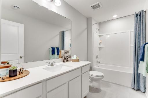 The shared bath on the upper level