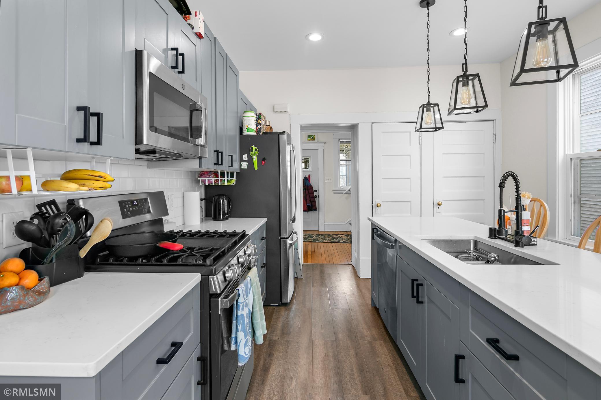 Kitchen facing the foyer and front entry