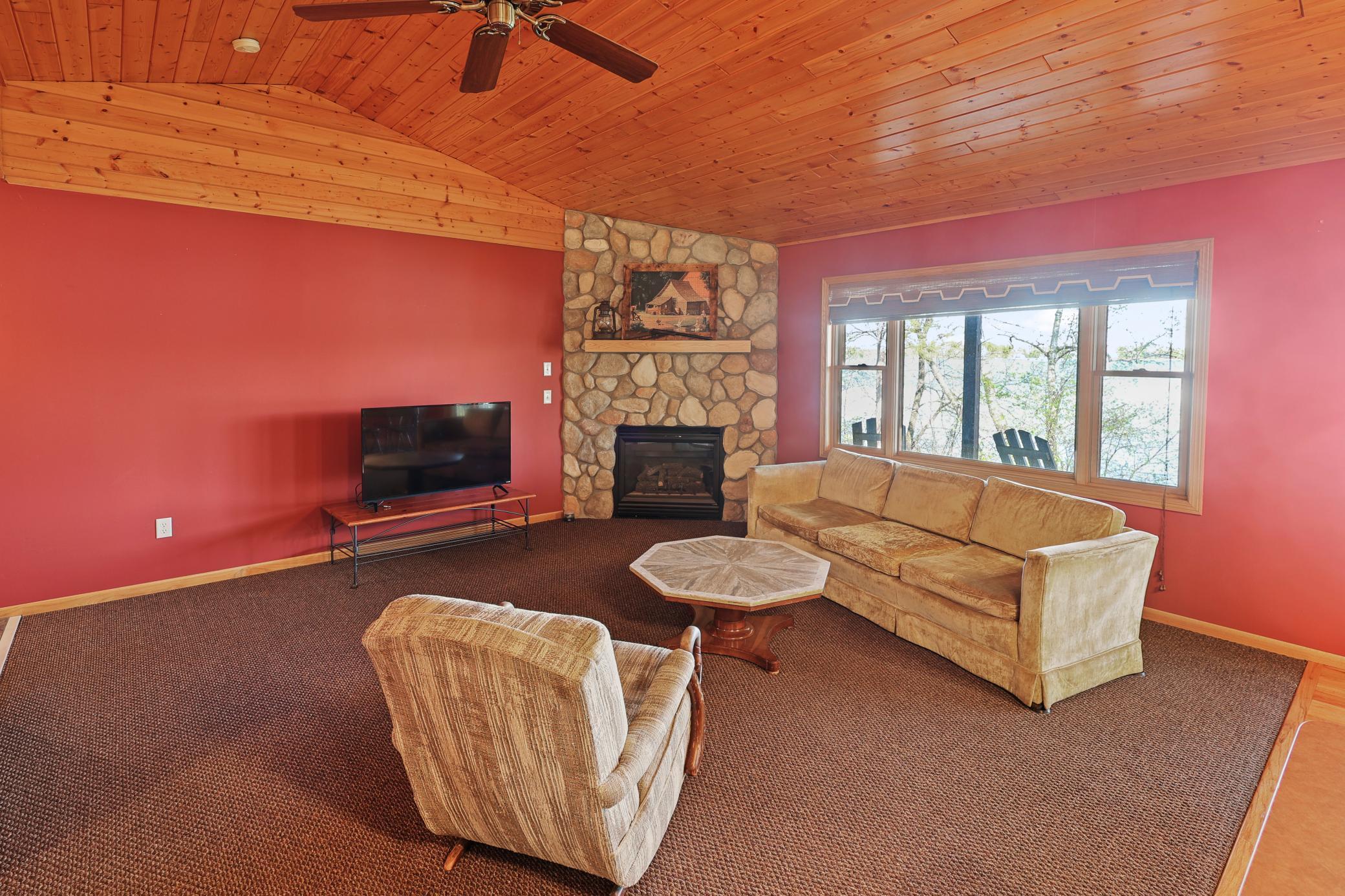 Wonderful living room with tongue and groove vaulted ceiling