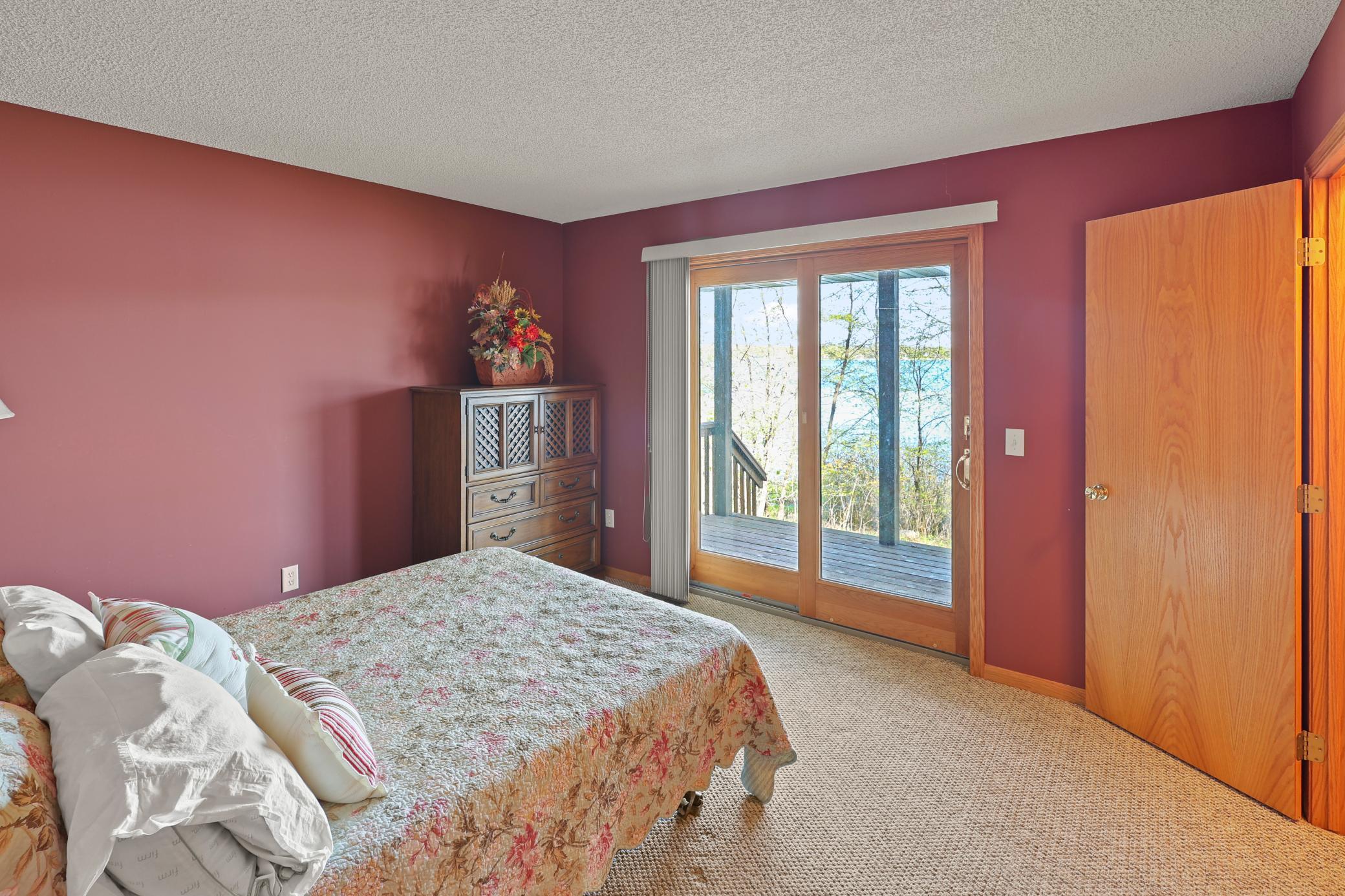 Primary bedroom walks out to covered porch